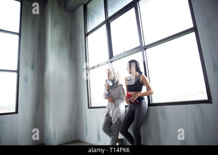 sport friend chat during exercise break Stock Photo