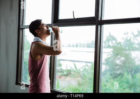 sport asian man drinking water Stock Photo