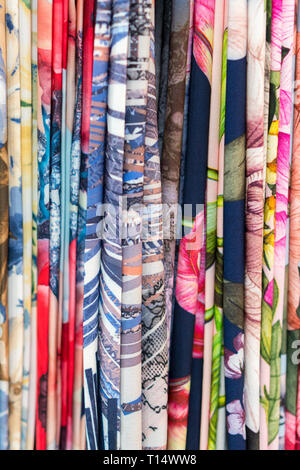 Colourful ethnic scarves in a medina location - close up and full frame. Multicolor fabric background. vertical photo. Stock Photo