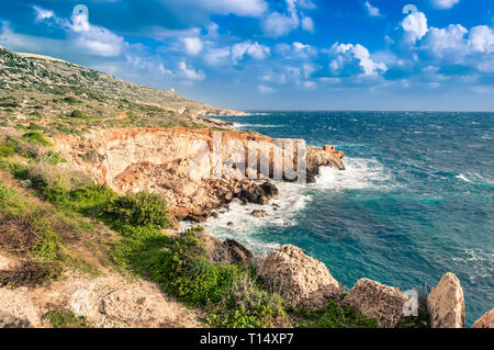 Ghar Lapsi Bay, Malta. Scenic coastline with rocky swimming cove and turquoise water Stock Photo