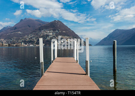 Wooden jetty on Lake Lugano, Ticino canton of Switzerland Stock Photo