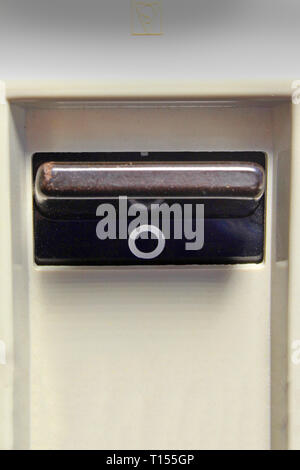 Vintage power switch on-off, isolated on white background, close-up Stock Photo