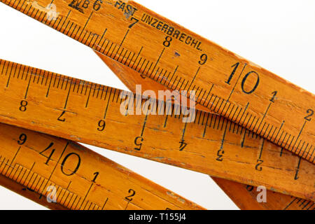 Vintage wooden folding ruler isolated on a white background.isolated on white background, close-up
