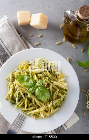 Trofie with genoese pesto sauce, a classic of Ligurian cuisine, Italy. Healthy food, diet and cooking concept. Food background with copy space. Top vi Stock Photo