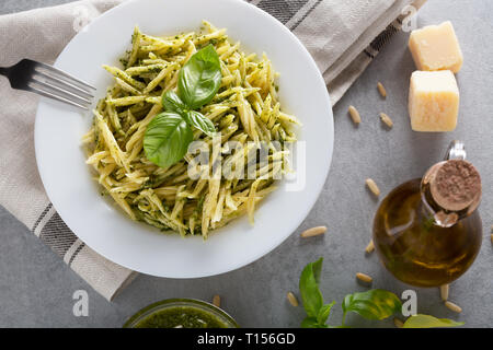 Trofie with genoese pesto sauce, a classic of Ligurian cuisine, Italy. Healthy food, diet and cooking concept. Food background with copy space. Top vi Stock Photo