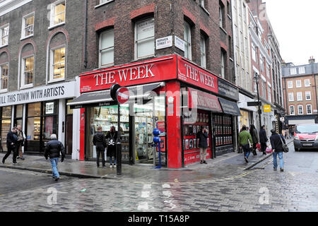 The Week newsagent shop on the corner of Berwick street on a rainy day  in February Soho London UK  KATHY DEWITT Stock Photo