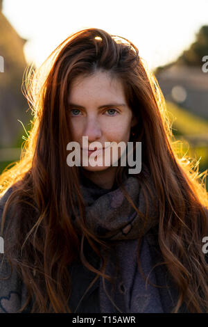Portrait of smiling young woman with nose piercing in autumn Stock Photo