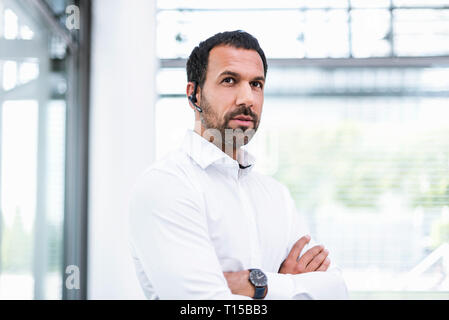 Businessman using headset Stock Photo