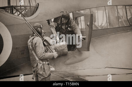 Flight crews with an Avro Anson (named after British Admiral George Anson) a British twin-engined, multi-role aircraft that served with the Royal Air Force (RAF) and Fleet Air Arm (FAA) during the Second World War. It was developed during the mid-1930s in response to a request for tenders issued by the British Air Ministry for a maritime reconnaissance aircraft. Initially used for maritime reconnaissance operation alongside the larger flying boats it was soon found to have become obsolete in front line combat roles and put to use as a multi-engined aircrew trainer. Stock Photo