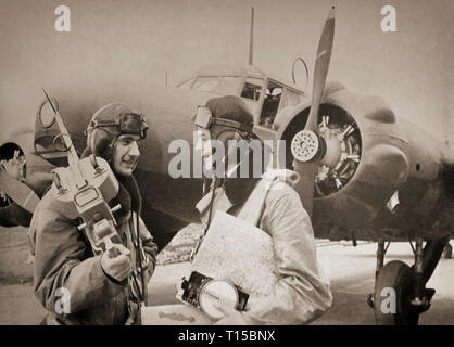 Flight crews with an Avro Anson (named after British Admiral George Anson) a British twin-engined, multi-role aircraft that served with the Royal Air Force (RAF) and Fleet Air Arm (FAA) during the Second World War. It was developed during the mid-1930s in response to a request for tenders issued by the British Air Ministry for a maritime reconnaissance aircraft. Initially used for maritime reconnaissance operation alongside the larger flying boats it was soon found to have become obsolete in front line combat roles and put to use as a multi-engined aircrew trainer. Stock Photo