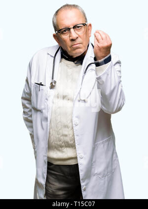 Handsome senior doctor man wearing medical coat Doing Italian gesture with hand and fingers confident expression Stock Photo