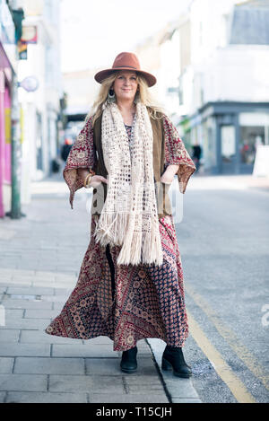 Brighton North Laine second hand vintage fashion clothing shop keepers stand in the street to have their portrait taken in a street style fashion. Stock Photo