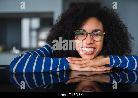 Portrait of happy young woman wearing glasses Stock Photo