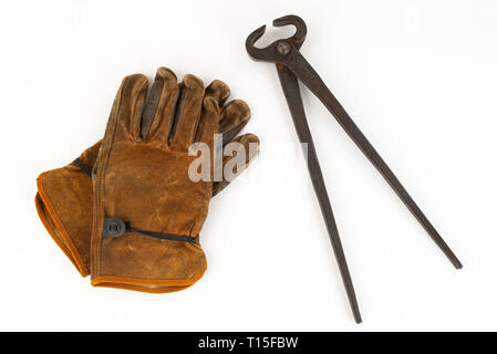 Vintage Pair Of Cutting Nippers Pliers and Work Gloves Stock Photo