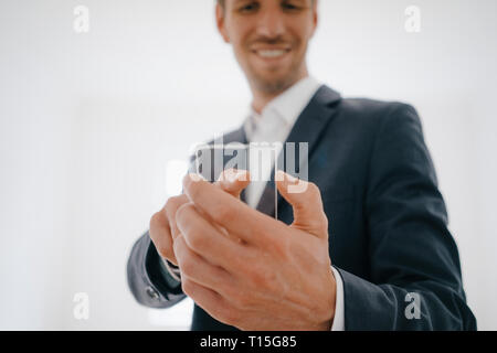 Businessman using glass touch screen in a new home Stock Photo
