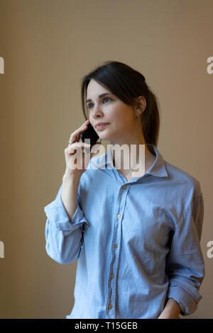 Young woman talking on the phone Stock Photo