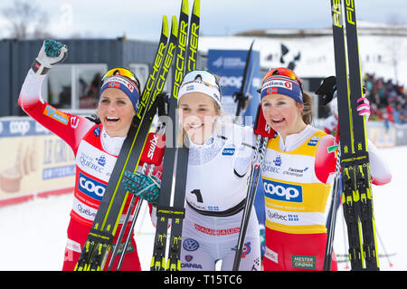 Quebec, QC, Canada. 23rd Mar, 2019. March 23, 2019- Quebec, Canada - Sweden's Stina Nilsson, centre, celebrates her victory with second-place Therese Johaug, left, of Norway and third place Ingvild Flugtad Oestberg, right, of Norway in the women's 10 km mass start classic FIS cross country World Cup in Quebec City. (Credit Image: © Patrice LAPOINTE/Scott@zumapress.com/ZUMA Press) Stock Photo