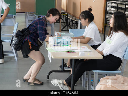 Bangkok, Thailand. 24th Mar, 2019. A Thai voter prepares to vote at a polling station in Bangkok, Thailand, March 24, 2019. Thai voters flock to polling stations across the country on Sunday for the country's first general election since the 2014 coup. Eligible voters have been lining up at polling station since 6:00 a.m. local time. Prime Minister Prayut Chan-o-cha cast his ballot at a station in Bangkok at about 8:30 a.m. local time. Credit: Zhang Keren/Xinhua/Alamy Live News Stock Photo