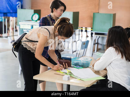 Bangkok, Thailand. 24th Mar, 2019. Thai voters prepare to vote at a polling station in Bangkok, Thailand, March 24, 2019. Thai voters flock to polling stations across the country on Sunday for the country's first general election since the 2014 coup. Eligible voters have been lining up at polling station since 6:00 a.m. local time. Prime Minister Prayut Chan-o-cha cast his ballot at a station in Bangkok at about 8:30 a.m. local time. Credit: Zhang Keren/Xinhua/Alamy Live News Stock Photo