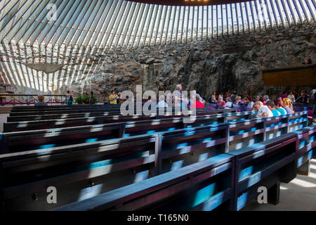 Interior view of the partially underground, rock-carved Temppeliaukio church in Helsinki, Finland. The Lutheran church has a natural appearance. Stock Photo