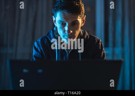 Cybercriminal hacker typing program code while stealing access databases with passwords. The concept of cyber security Stock Photo