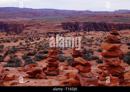 Rocks are stacked, known as cairns, along the trail to horseshoe Bend in Page, Arizona. Stock Photo