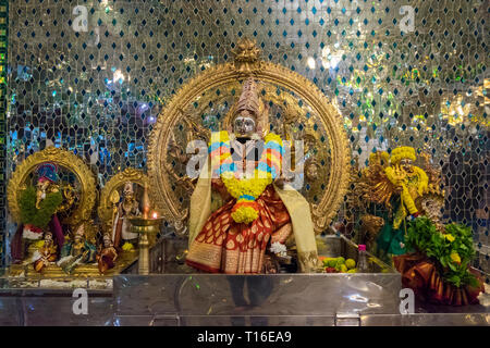 The unique Arulmigu Sri Rajakaliamman Glass Temple in Johor Bahru, Malaysia. The interior is completely covered in glass tiles. Icon detail. Stock Photo