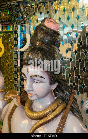 The unique Arulmigu Sri Rajakaliamman Glass Temple in Johor Bahru, Malaysia. The interior is completely covered in glass tiles. Two headed man detail. Stock Photo