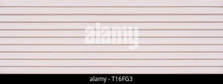 Abstract white pink brick wall texture background. Horizontal panoramic view of masonry brick wall for interior design. Stock Photo