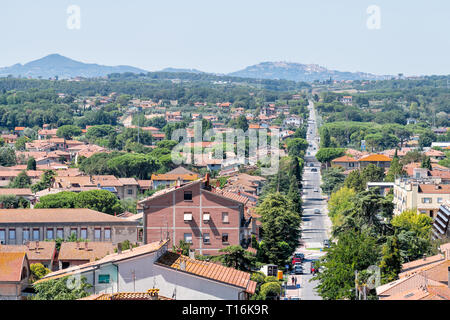 Castiglione del Lago, Italy - August 28, 2018: Aerial high angle view on Umbria Rocca in sunny summer day with cityscape of houses and street road Stock Photo