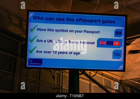 Sign giving instructions for ePassport gates at Stansted Airport, London, UK Stock Photo