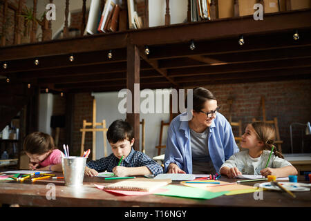 Art Teacher with Group of Kids Stock Photo