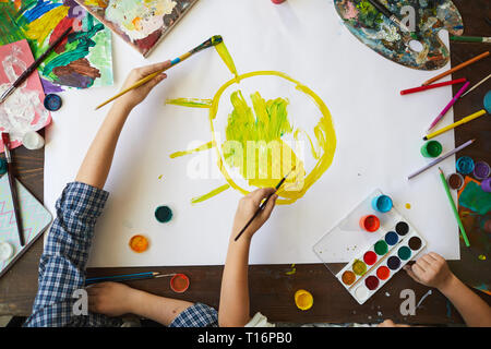 Kids Painting Sun Above View Stock Photo