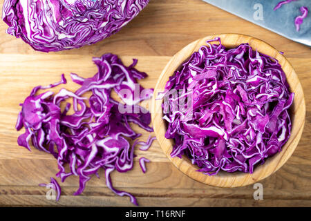finely chopped purple cabbage in a plate on the table. fresh vitamin salad Stock Photo
