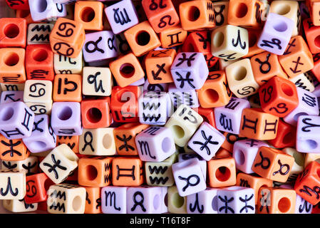 Multi-colored cubes with zodiac signs close-up. Stock Photo