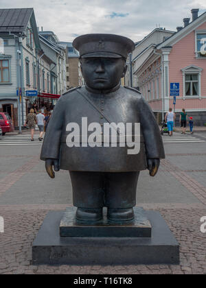 Oulu, Finland - July 26, 2018: Image of the Topolliisi a bronze statue of a policeman, made by the sculptor Kaarlo Mikkonen. Stock Photo