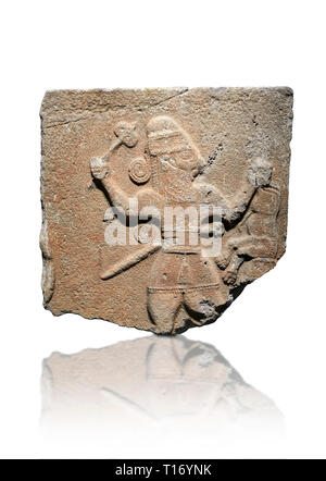 Hittite monumental relief sculpture of a man with an axe in one hand about to use it to kill a lion he is holding updide down in his other hand. Late  Stock Photo