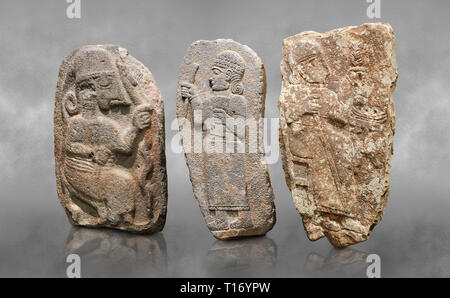 Hittite monumental relief sculptures, 900 - 700 BC, from Adana Archaeology Museum, Turkey. Against a grey art background Stock Photo