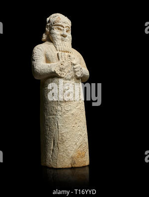 Hittite monumental statue probably of Tarhunda, the Storm God, standing on a cart being pulled by two bulls. Adana Archaeology Museum, Turkey. Against Stock Photo