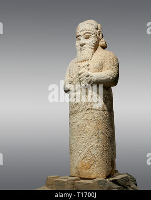 Hittite monumental statue probably of Tarhunda, the Storm God, standing on a cart being pulled by two bulls. Adana Archaeology Museum, Turkey. Against Stock Photo