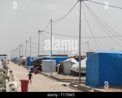 22.05.2017, Quarato Camp, Iraq.: Kids playing in the street of an off-limits Refugee camp in northern Iraq Stock Photo