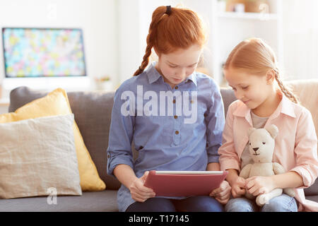 Two Children using Digital Tablet Stock Photo