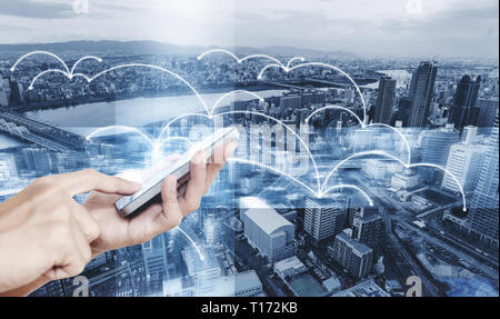 Smart technology, internet 5G and network connection. Hand using mobile smart phone with networking technology graphic Stock Photo