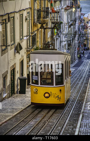 LISBON, PORTUGAL – LISBON, PORTUGAL – September 08, 2016: The number 28 Lisbon tram, considered one of the main attractions of the city, passes throug Stock Photo