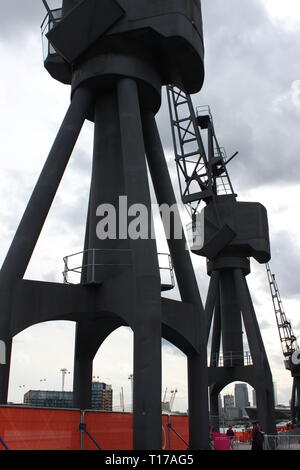 Huge dock crane against a cloudy blue sky Stock Photo - Alamy