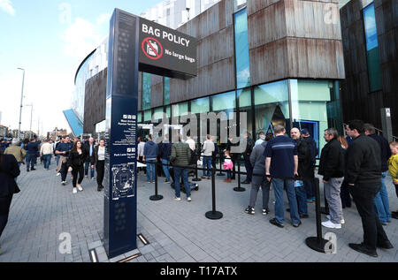 Fans make their way to the stadium prior to the U18 Premier League test event match at Tottenham Hotspur Stadium, London. Stock Photo