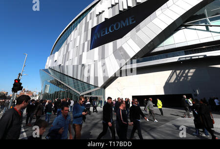 Fans make their way to the stadium prior to the U18 Premier League test event match at Tottenham Hotspur Stadium, London. Stock Photo