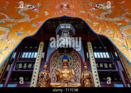 Hangzhou, China - August 14, 2011: View of Buddha statues inside Lingyin Temple. This temple is one of the most famous and visited spot of the city Stock Photo