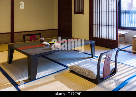 Takayama, Japan - April 25, 2014: The room interior of a ryokan. A ryokan  is a type of traditional Japanese inn that typically feature tatami rooms Stock Photo
