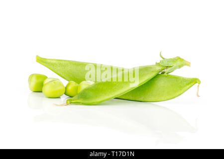 Group of two whole green sugar snap pea pod with three peas isolated on white background Stock Photo